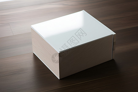 白盒子放在宣传册文桌子高清图片