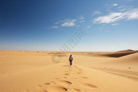一个人在沙漠上行走背景图片