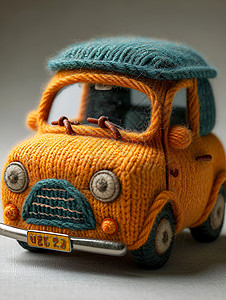 小巧可爱的毛绒汽车玩具背景图片