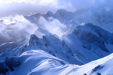 云雾缭绕的雪峰背景图片