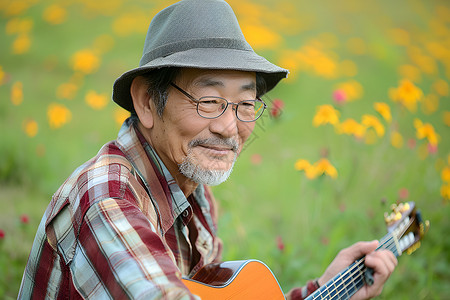 演奏吉他的老年男性背景图片