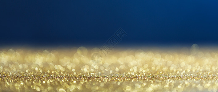 金色蓝色圣诞背景与Bokeh灯金色蓝色圣诞背景图片