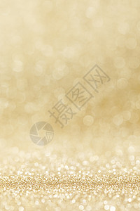 闪亮的金色波克闪光灯抽象背景,圣诞新年派庆祝闪亮的金色灯光背景图片