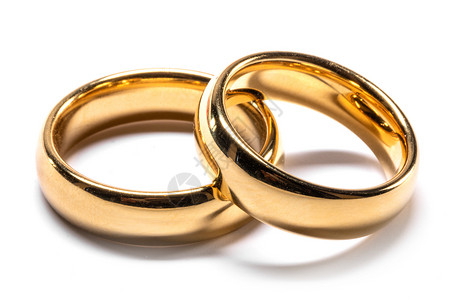 几个金色的结婚戒指隔离白色的背景上白色的金色结婚戒指图片