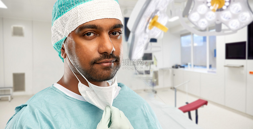医学,外科医疗保健印度男医生或外科医生与保护面具手术室医院背景医院医生或外科医生的脸图片