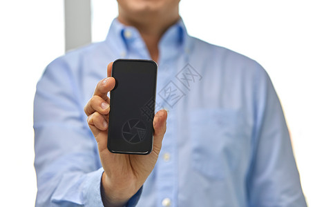 商业,人技术密切的商人智能手机黑色空白屏幕智能手机屏幕的商人图片