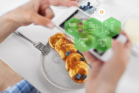 食物,饮食技术手与煎饼智能手机超过营养价值图表手煎饼营养价值图图片