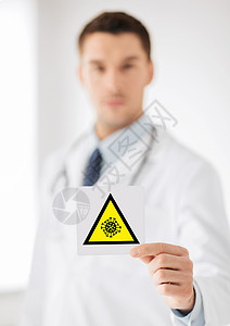 健康,医学大流行男医生持有冠状病标志男医生持有冠状病警告标志图片