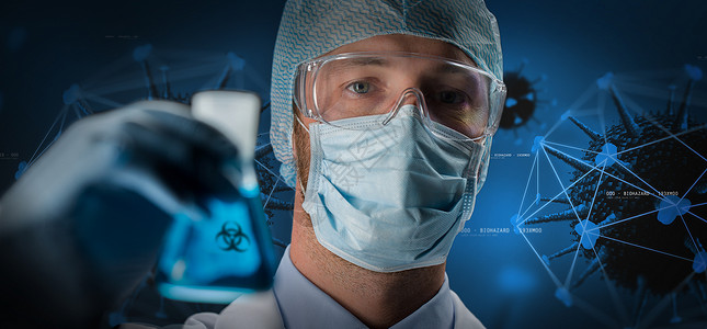 科学医学流行病黑色背景下,戴护目镜面罩的男科学家冠状病全息图上佩戴生物危害标志的面罩科学家冠状病全息背景图片