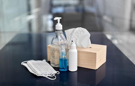 消菌剂卫生消同的洗手液,液体肥皂,面部防护医疗口罩纸巾桌子上洗手液,口罩,液体肥皂织背景