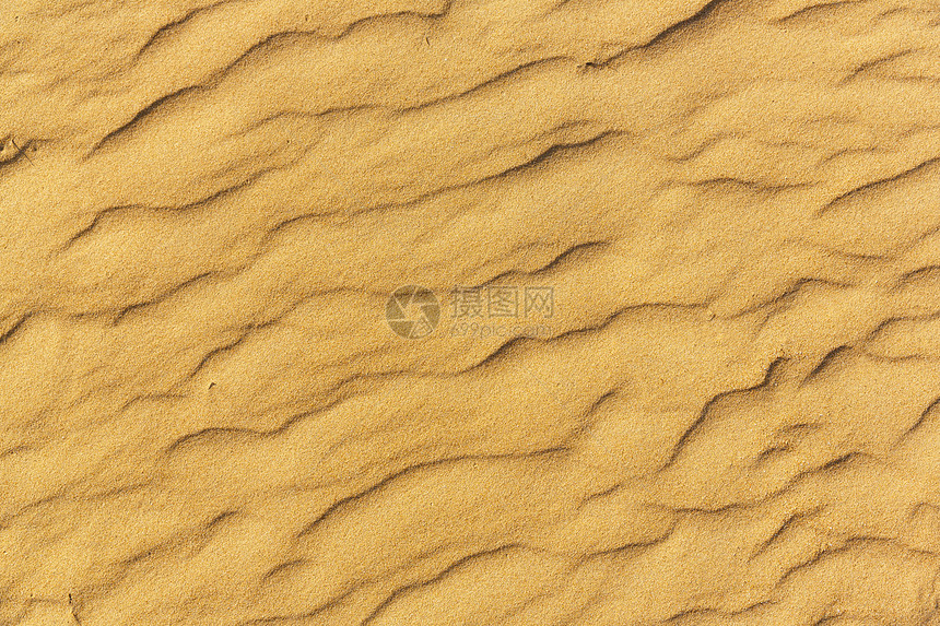 海滩上的特写沙子纹理图片