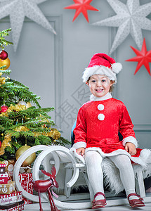 可爱的小精灵坐圣诞雪橇上图片