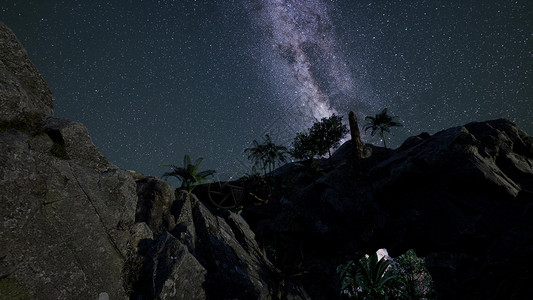 砂岩峡谷墙壁上的4k天体摄影星迹背景图片