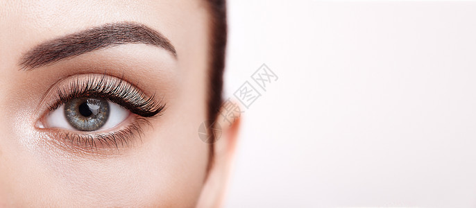 戴假睫毛女眼睛有极长的假睫毛睫毛扩展化妆,化妆品,美容,背景