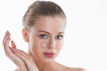乳杆菌素完美的女脸手特写健康的女人面部治疗美容完美的女脸特写背景