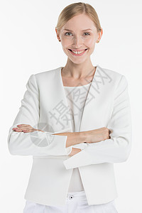 成熟微笑的商业女人的肖像,穿着白色西装,孤立白色背景上成熟的微笑的女人图片