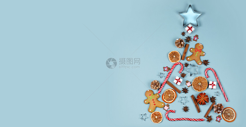 圣诞树符号成姜饼干焦糖罐头塑造明星形式的礼物橙色鲍布,平躺与圣诞树的象征图片