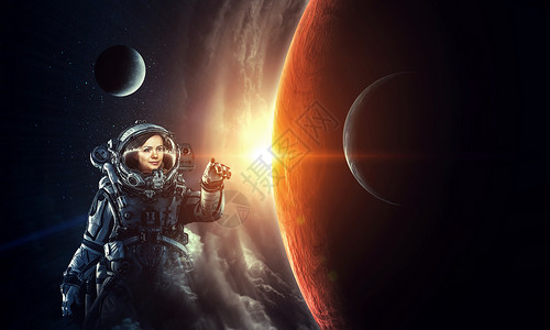太空中的女宇航员接触行星这幅图像的元素由美国宇航局提供探索外层图片