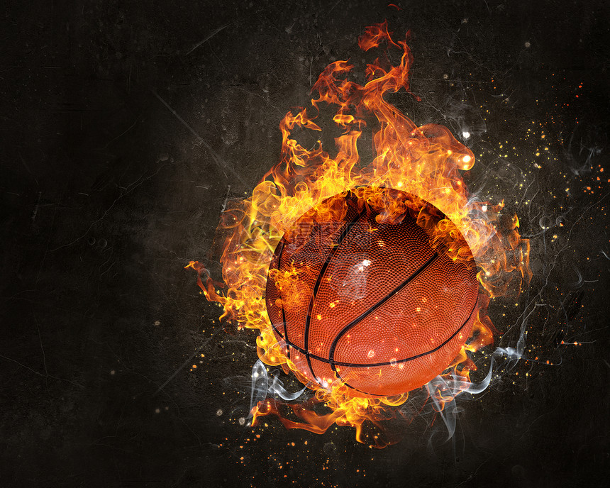 黑暗背景下的火焰中的球篮球比赛的图片
