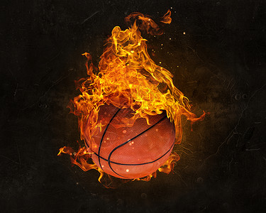 黑暗背景下的火焰中的球篮球比赛的背景图片