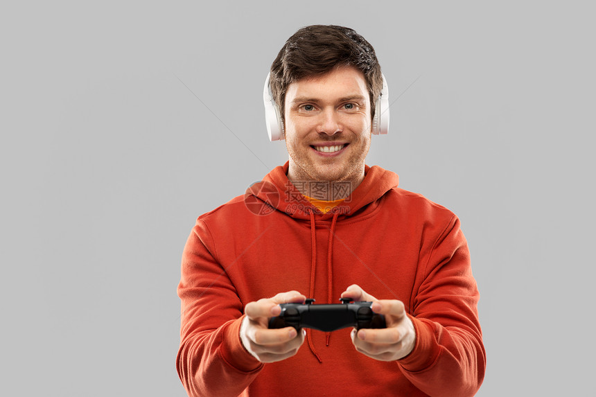 技术,游戏人的轻人玩家耳机与游戏广告玩电子游戏玩电子游戏的玩游戏的人图片