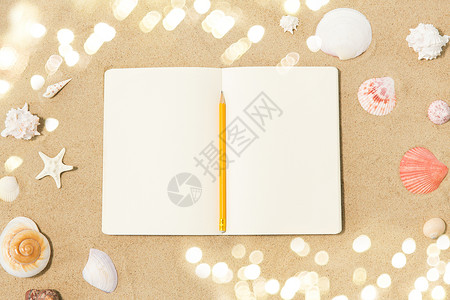 假期,旅行夏季笔记本与铅笔贝壳海滩沙滩笔记本上铅笔贝壳沙滩上图片