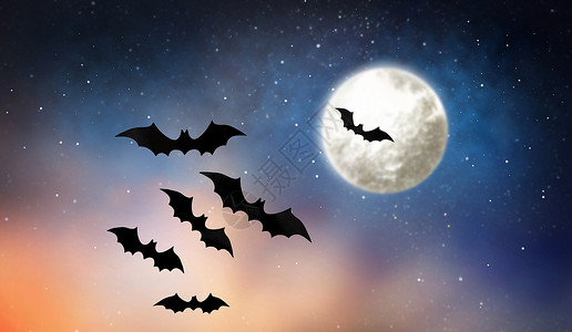 蝙蝠漂浮万节装饰黑色蝙蝠星空背景下飞越月球黑色蝙蝠星空中飞过月亮背景