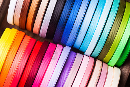 各种颜色的丝带筒子彩色丝带筒子顶部视图图片