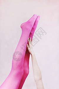 女腿穿粉红色紧身衣背景图片
