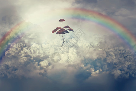 举个栗想象中的景色,个轻的男孩举着很多雨伞,云层上方飞翔天空彩虹下的人生旅程背景