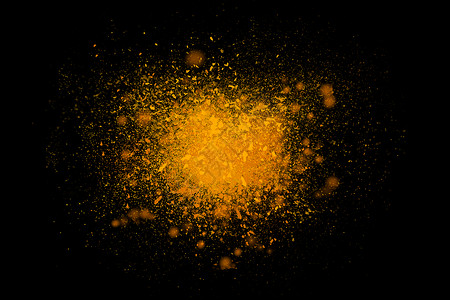 彩色黄色粉末黑色黑暗背景上爆炸的冻结运动彩色尘埃云的抽象粒子爆炸屏幕保护程序,壁纸,刷子宇宙创造背景图片