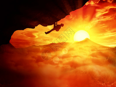 美丽的背景与个登山者试图爬上云层日落图片
