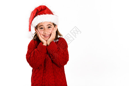 可爱的小女孩戴着诞老人的帽子,隔离白色的背景上诞节的冬天衣服图片