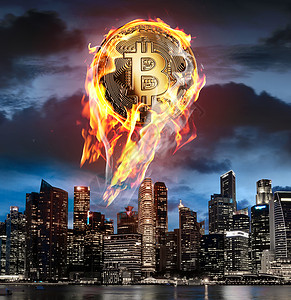 比特币着火了比特币着火了燃烧的BTC硬币正上升商业摩天大楼上方的夜空背景图片