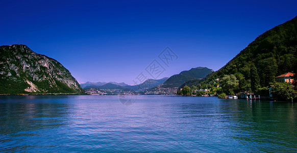 瑞士蒂奇诺卢加诺市海岸线湖泊的风景背景图片