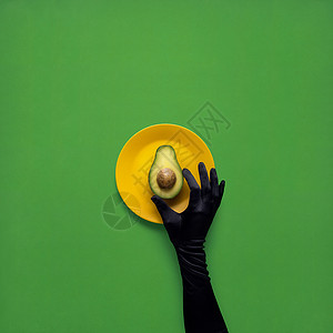 创意照片的鳄梨与手绘板绿色背景背景图片