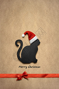 创意照片诞猫帽子与标志棕色背景图片