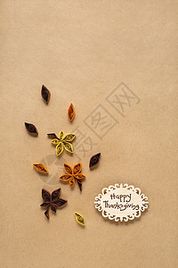 创意感恩节照片的叶子制成的纸张棕色背景背景图片