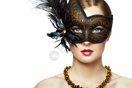 美丽的轻女人戴着神秘的黑色威尼斯具时尚照片用黑色羽毛伪装具图片