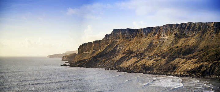 海景白兰地海湾景观多塞特黎明与悬崖消失远处图片