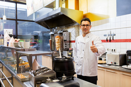 马尔多纳多人,快餐烹饪厨师烤肉店展示大拇指烤肉店的厨师竖大拇指背景