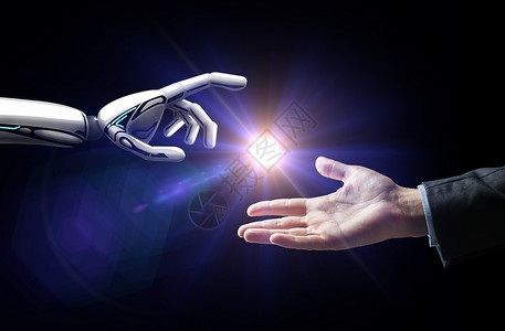 人工智能,未来技术商业机器人人的手与闪光灯黑色背景机器人人类的手闪过黑色的光背景