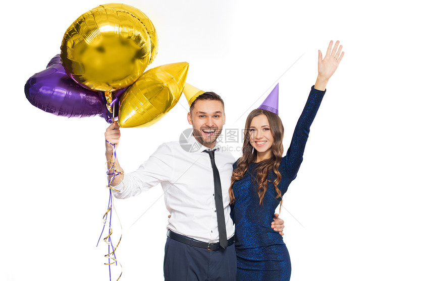 人们,庆祝节日的幸福的夫妇与派帽气球带着派帽气球的幸福夫妇图片