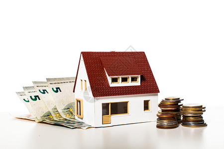 白色背景上的硬币上的钱屋公用事业付款补贴的钱的房子高清图片