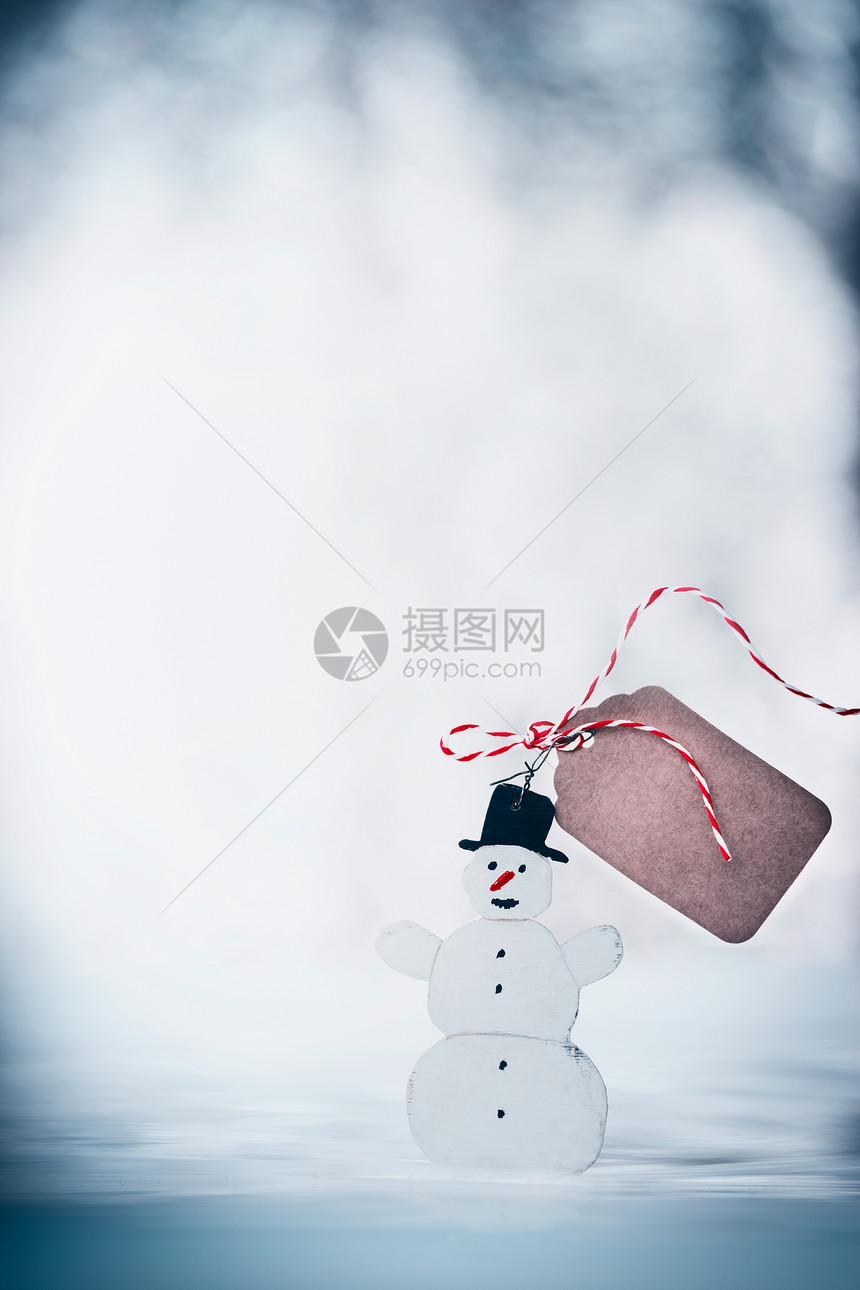 快乐的雪人与黑色帽子,标签模拟丝带雪冬的背景寒假卡图片