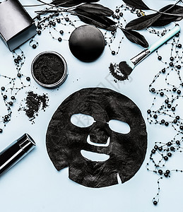 黑色薄片具化妆品与活炭,顶部视图美容现代护肤理念品牌模拟图片