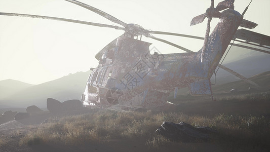 日落时分,沙漠中老旧生锈的用直升机背景图片
