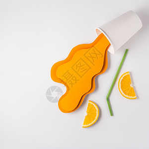 创意照片带走杯子与飞溅橙汁制成的纸灰背景高清图片