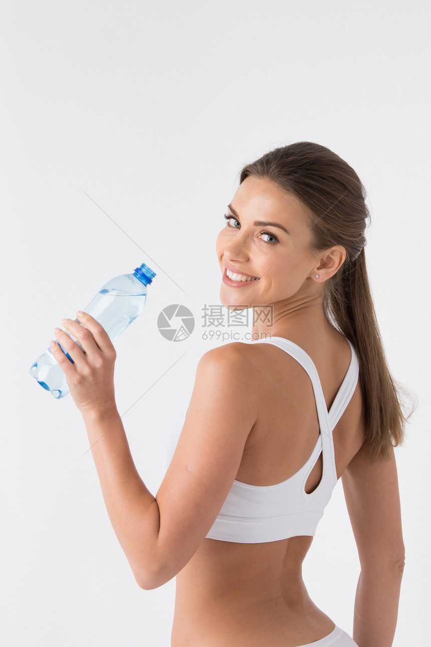 穿着白色运动内衣的漂亮女人,白色的瓶水瓶水超过白色的女人图片