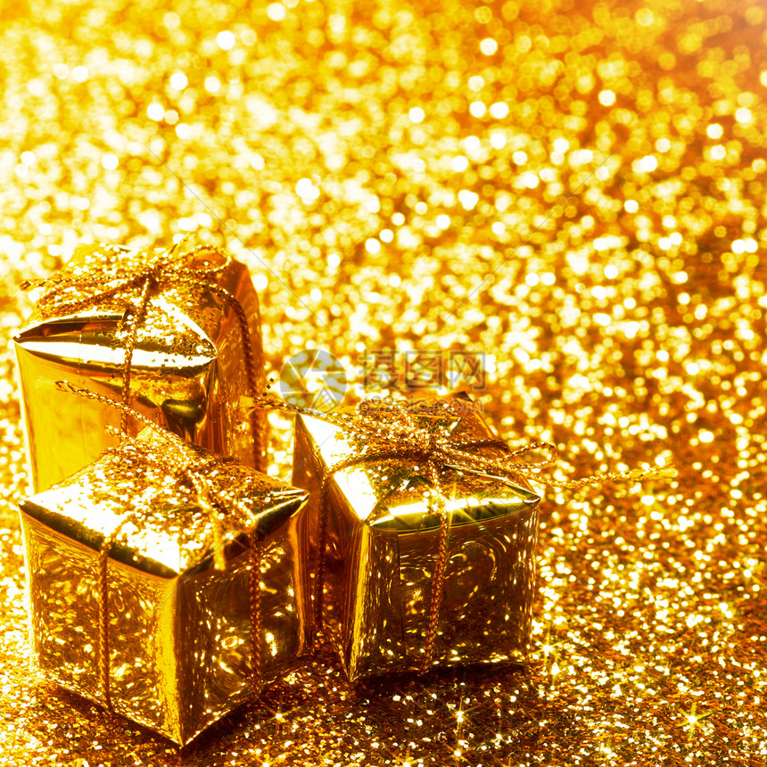 装饰金色盒子与节日礼物闪亮的闪光背景图片
